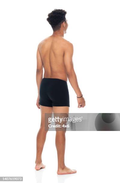 african ethnicity male standing in front of white background wearing boxer shorts - boys bare bum stock pictures, royalty-free photos & images