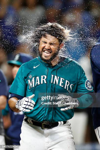 Eugenio Suarez of the Seattle Mariners reacts after his walk-off three run home run against the Toronto Blue Jays during the eleventh inning at...