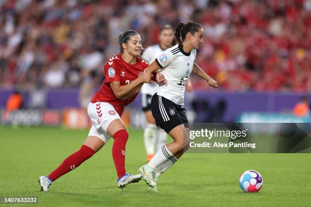 Sara Dabritz of Germany is tackled by Signe Bruun of Denmark during the UEFA Women's Euro England 2022 group B match between Germany and Denmark at...