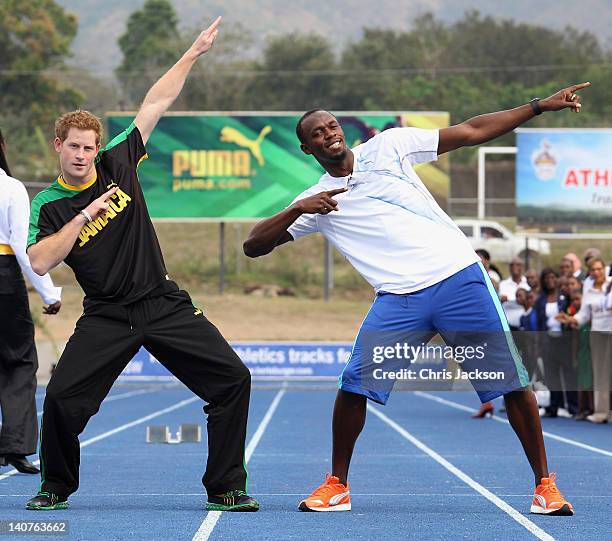 Prince Harry poses with Usain Bolt at the Usain Bolt Track at the University of the West Indies on March 6, 2012 in Kingston, Jamaica. Prince Harry...