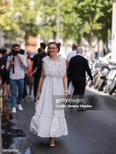 Eileen Vu seen with pigtails wearing white dress and heels and a white leather handbag and sunglasses outside the Viktor and Rolf show, during Paris...