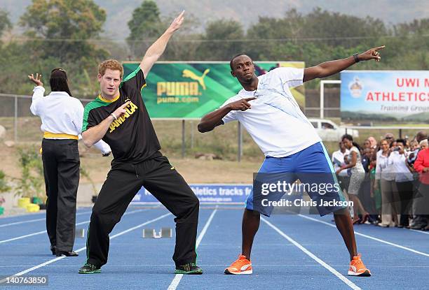Prince Harry poses with Usain Bolt at the Usain Bolt Track at the University of the West Indies on March 6, 2012 in Kingston, Jamaica. Prince Harry...