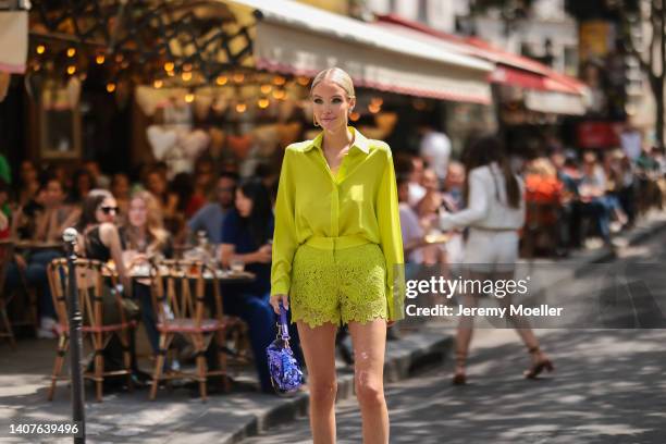 Leonie Hanne seen wearing yellow button shirt, laced shorts, purple bag, heels outside Elie Saab, during Paris Fashion Week - Haute Couture Fall...