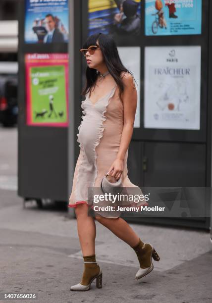 Susie Lau seen wearing beige grey two tone sheer dress outside Fendi, during Paris Fashion Week - Haute Couture Fall Winter 2022 2023, on July 07,...