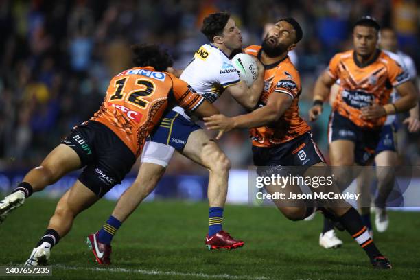 Mitchell Moses of the Eels/tb Zane Musgrove of the Tigers during the round 17 NRL match between the Wests Tigers and the Parramatta Eels at...