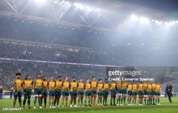 Australia sing the National Anthem during game two of the International Test Match series between the Australia Wallabies and England at Suncorp...