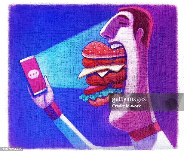 nerd isst hamburger und schaut auf smartphone - nerd stock-grafiken, -clipart, -cartoons und -symbole