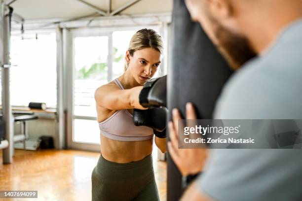 woman boxing in a gym - boxing womens stock pictures, royalty-free photos & images