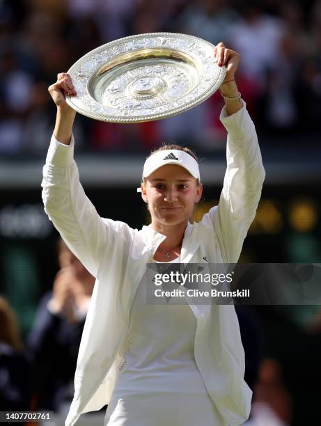 Elena Rybakina of Kazakhstan celebrates with the trophy after victory against Ons Jabeur of Tunisia during the Ladies' Singles Final match on day...