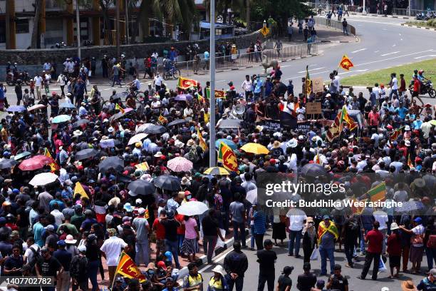 Anti-government protesters gather in the street during protests calling for the resignation of Sri Lanka's President Gotabaya Rajapaksa and Prime...