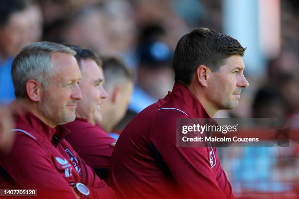 Aston Villa assistant head coach Neil Critchley and Aston Villa manager Steven Gerrard look on during the Pre-Season Friendly between Walsall and...