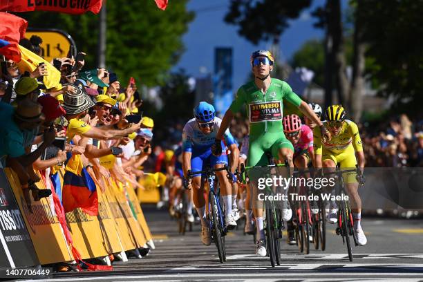 Wout Van Aert of Belgium and Team Jumbo - Visma - Green Points Jersey celebrates at finish line as stage winner ahead of Michael Matthews of...