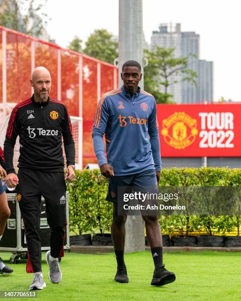 Manager Erik ten Hag and Axel Tuanzebe of Manchester United in action during a first team training session at STB Academy on July 09, 2022 in...