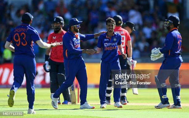 Yuzvendra Chahal of India celebrates taking the wicket of Dawid Malan of England with teammates during the 2nd Vitality IT20 between England and...