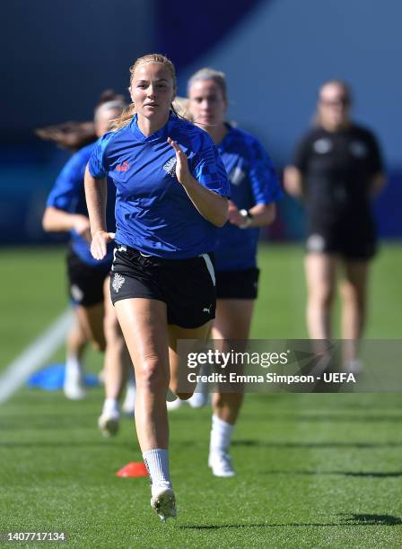 Glodis Viggosdottir of Iceland warms up during the UEFA Women's Euro 2022 Iceland Training Session at Manchester City Academy Stadium on July 09,...