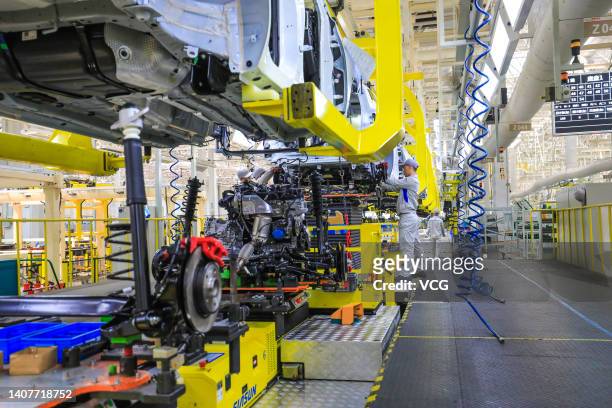 Vehicles are assembled at a Cowin Auto smart plant on July 9, 2022 in Yibin, Sichuan Province of China.