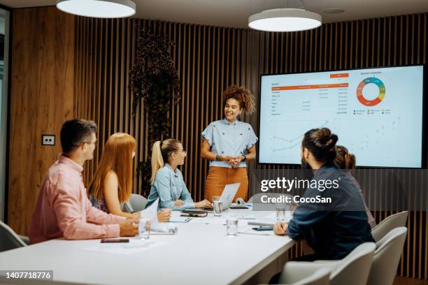 multiracial business team working together in office, african american businesswoman having presentation about investments - teen entrepreneur stock pictures, royalty-free photos & images