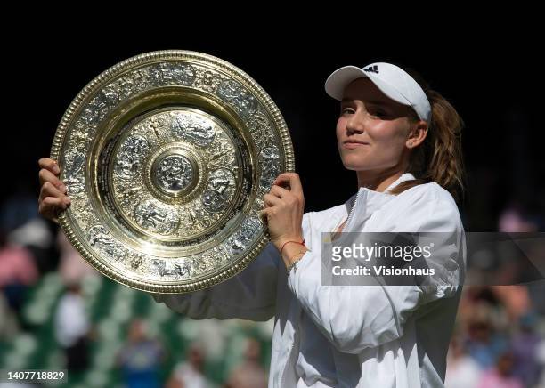Elena Rybakina of Kazakhstan poses with the Venus Rosewater Dishafter winning her match against Ons Jabeur of Tunisia during the Ladies' Singles...