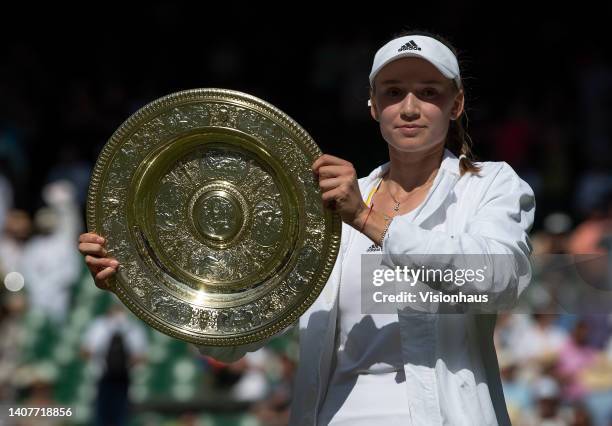 Elena Rybakina of Kazakhstan poses with the Venus Rosewater Dishafter winning her match against Ons Jabeur of Tunisia during the Ladies' Singles...