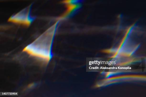 colourful rainbow light leaks texture on black background - filmstreifen stock-fotos und bilder