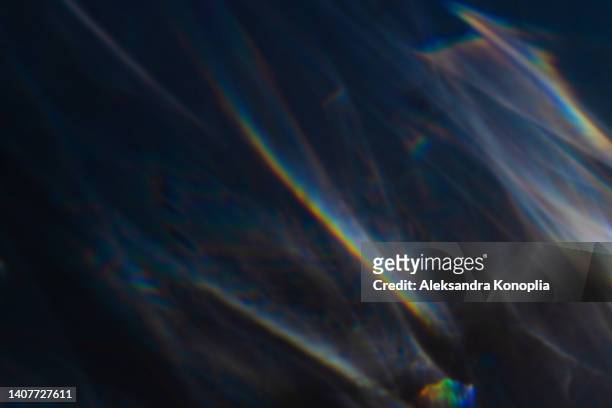 colourful rainbow light leaks texture on black background - distress flare stock pictures, royalty-free photos & images