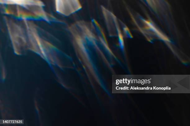 colourful rainbow light leaks texture on black background - perda imagens e fotografias de stock