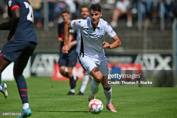 Janni Luca Serra of Bielefeld runs with the ball during the pre-season friendly match between DSC Arminia Bielefeld and PSV Eindhoven at...