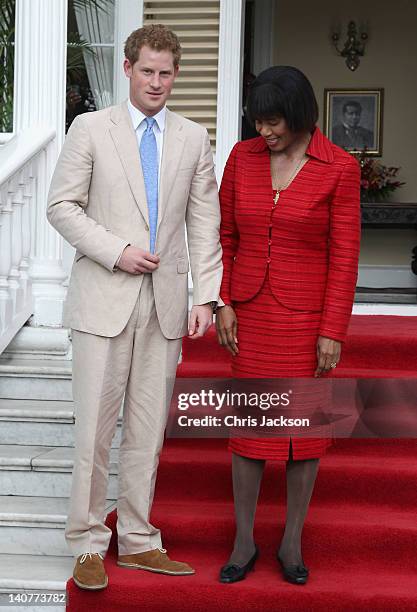 Prince Harry and Prime Minister of Jamaica Portia Simpson-Miller meet on the steps of Devon House on March 6, 2012 in Kingston, Jamaica. Prince Harry...