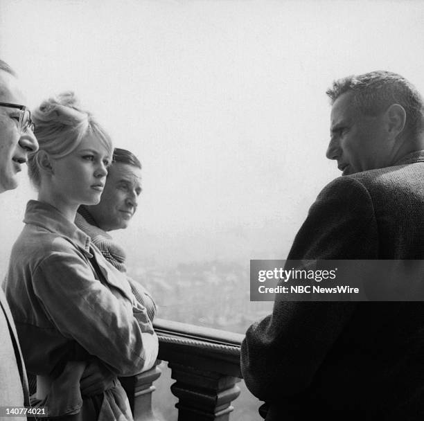 In Paris 1959" -- Pictured: French actress Brigitte Bardot, director Christian-Jaque, unknown at the Eiffel Tower in Paris, France from April 27 -...