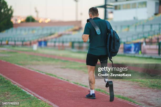 amputee athlete training - man leaving stock pictures, royalty-free photos & images