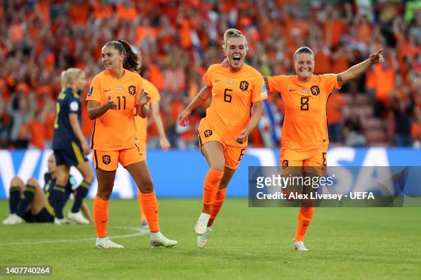 Jill Roord celebrates with Lieke Martens and Sherida Spitse of The Netherlands after scoring their team's first goal during the UEFA Women's Euro...