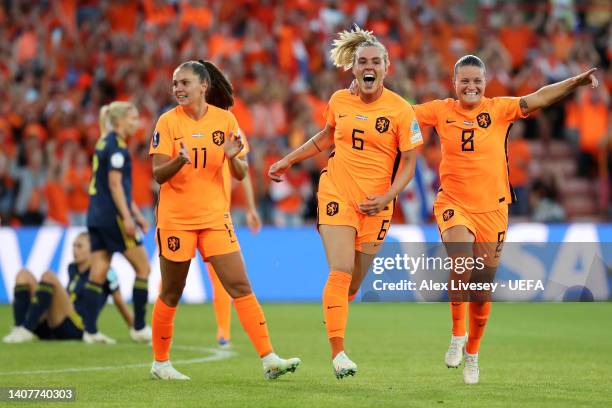 Jill Roord celebrates with Lieke Martens and Sherida Spitse of The Netherlands after scoring their team's first goal during the UEFA Women's Euro...