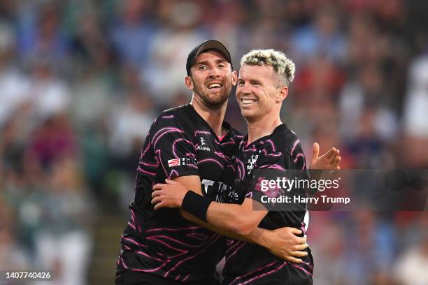 Peter Siddle of Somerset celebrates the wicket of Hilton Cartwright of Derbyshire Falcons with team mate Craig Overton during the Vitality T20 Blast...