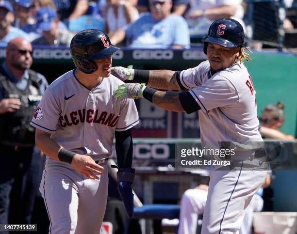 Jose Ramirez of the Cleveland Guardians celebrates his two-run home run with Steven Kwan in the second inning against the Kansas City Royals at...