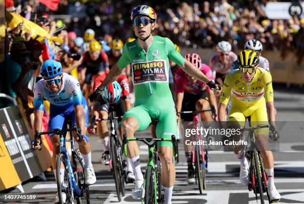 Green jersey of best sprinter Wout van Aert of Belgium and Jumbo - Visma celebrates winning Stage 8, left second place Michael Matthews of Australia...
