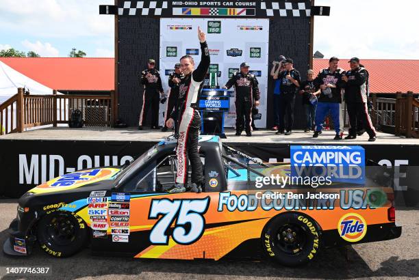 Parker Kligerman, driver of the Food Country USA/Tide Chevrolet, celebrates in victory lane after winning the NASCAR Camping World Truck Series...