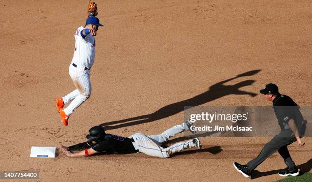 Nick Fortes of the Miami Marlins steals second base during the fifth inning as Luis Guillorme of the New York Mets reaches for a high throw at Citi...