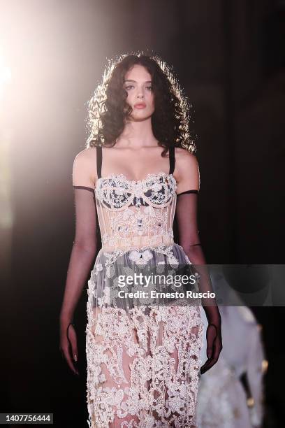 Deva Cassel walks the runway at the Dolce & Gabbana haute couture fall/winter 22/23 event on July 09, 2022 in Siracusa, Italy.