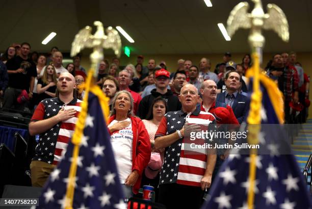 Attendees recite the Pledge of Allegiance during a "Save America" rally at Alaska Airlines Center on July 09, 2022 in Anchorage, Alaska. Former...