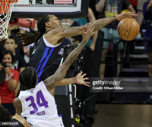 Emanuel Terry of the Orlando Magic blocks a shot by Keon Ellis of the Sacramento Kings with the scored tied 87-87 in overtime to force sudden death...