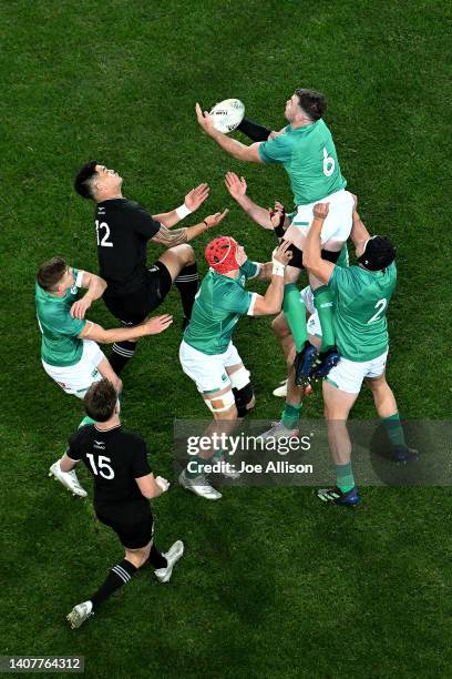 Peter O'Mahony of Ireland secures the ball away from Quinn Tupaea of the All Blacks during the International Test match between the New Zealand All...