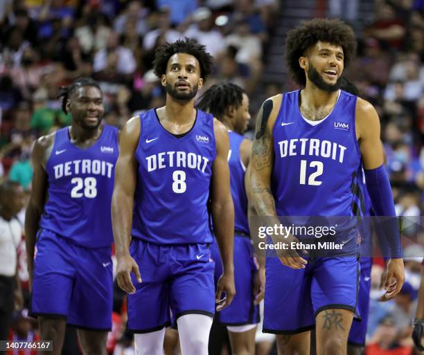 Isaiah Stewart, Braxton Key and Isaiah Livers of the Detroit Pistons walk on the court during a break in a game against the Washington Wizards during...