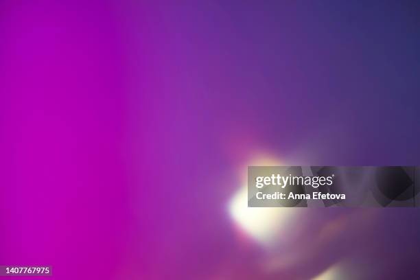 blurred colorful neon background with abstract shadows and lights pattern. copy space for your design. trendy colors of the year. - light flare stockfoto's en -beelden