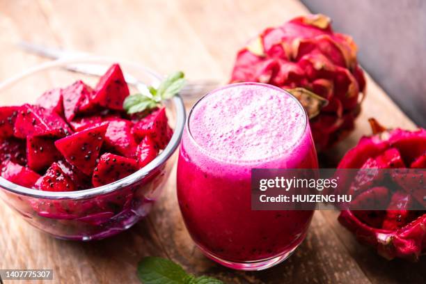pitaya juice on a wooden board ornamented with mint leaves - pitaya stock pictures, royalty-free photos & images