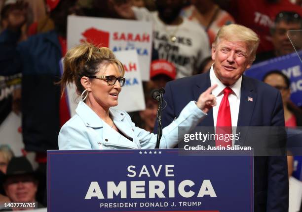 Republican U.S. House candidate former Alaska Gov. Sarah Palin speaks as former U.S. President Donald Trump looks on during a "Save America" rally at...