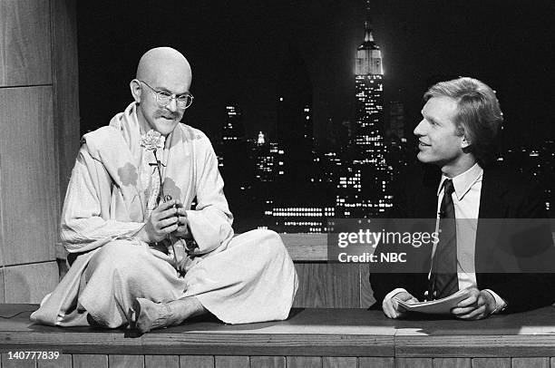 Episode 13 -- Pictured: Tim Havnagootiim Vishnuuerheer, Brad Hall during the 'Saturday Night News' skit on February 19, 1983 -- Photo by: Al...