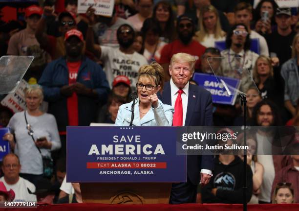 Republican U.S. House candidate former Alaska Gov. Sarah Palin speaks as former U.S. President Donald Trump looks on during a "Save America" rally at...