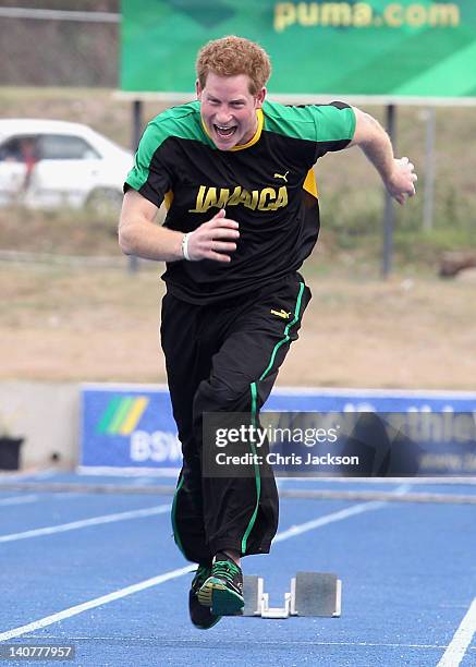 Prince Harry races Usain Bolt at the Usain Bolt Track at the University of the West Indies on March 6, 2012 in Kingston, Jamaica. Prince Harry is in...