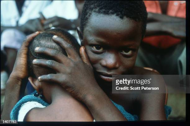 Sierra Leonan refugees sit at an old school in Foya August 10, 1992 in Liberia. The National Patriotic Front of Liberia , which rebelled against the...