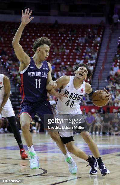 Colbey Ross of the Portland Trail Blazers drives against Dyson Daniels of the New Orleans Pelicans during the 2022 NBA Summer League at the Thomas &...